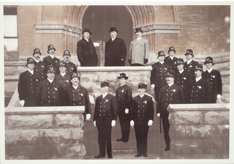 An image of Mayor John M. Haines, Chief Ben F. Francis, and the Boise Police Force in front of Old Boise City Hall in 1907.
