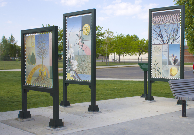 Three double-sided paintings framed and mounted on two-legged stands painted green. Each painting depicts symbols of science and geometry with objects of nature or playful activities that exhibit similar patterns. 