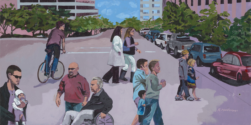 A number of people crossing a street in downtown Boise.