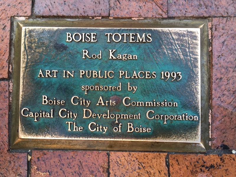 Three bronze sculptures of geometrically abstracted columns. 