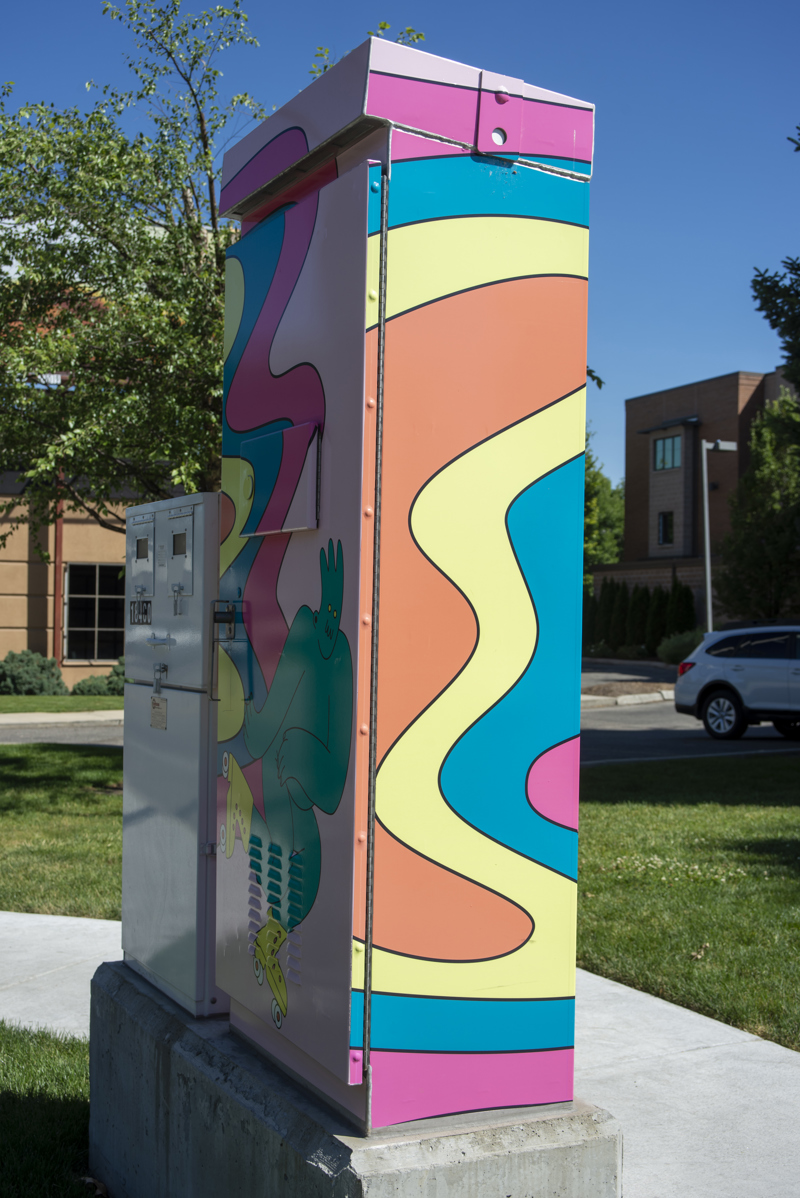 Side 2: Colorful, wavy lines of orange, yellow, blue, magenta, and pink.