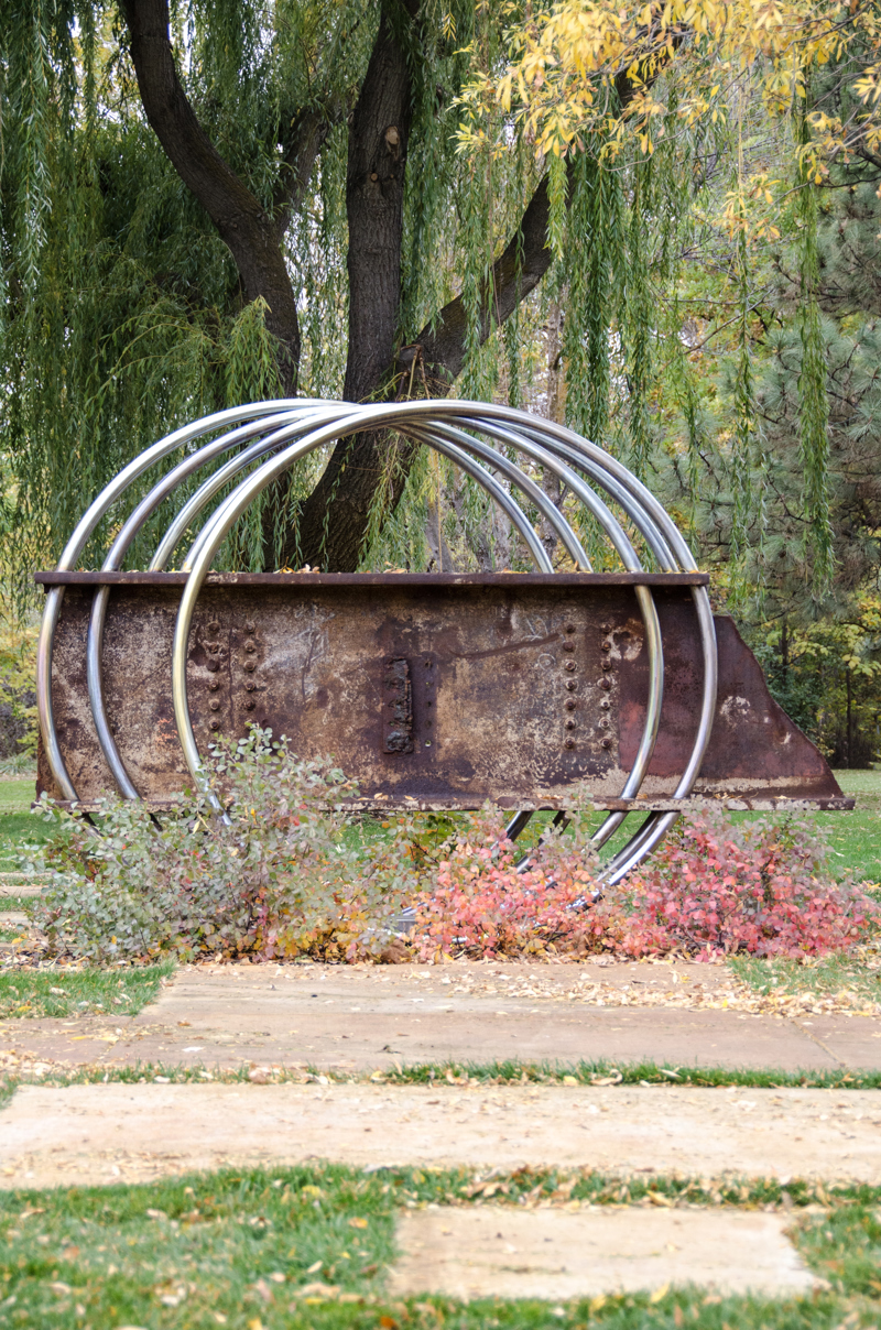A steel beam from the World Trade Center destroyed on September 11, 2001. The beam has 5 stainless steel rings that appear to run through it and hold it up, making it seemingly float. 