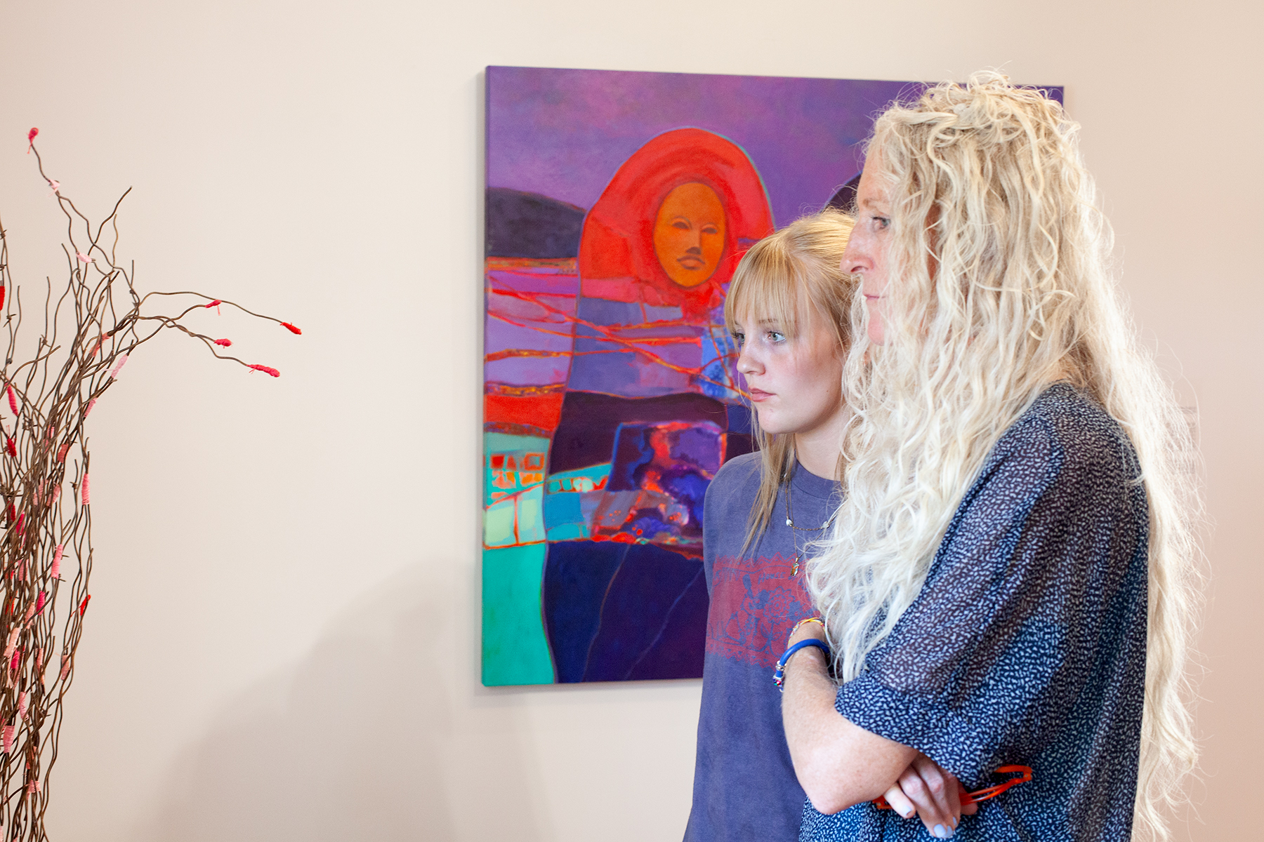 Visitors to American Contradictions Exhibition view art work.