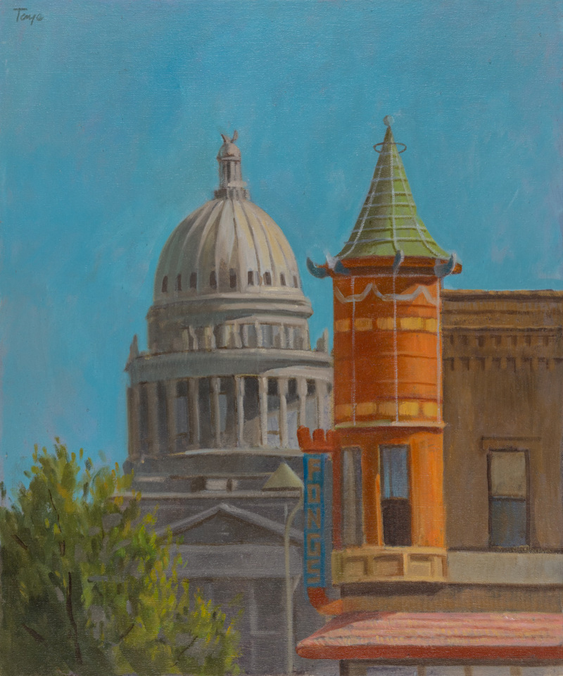 A painting of the Idaho State Capitol Building behind the turret of the Adelmann Building.